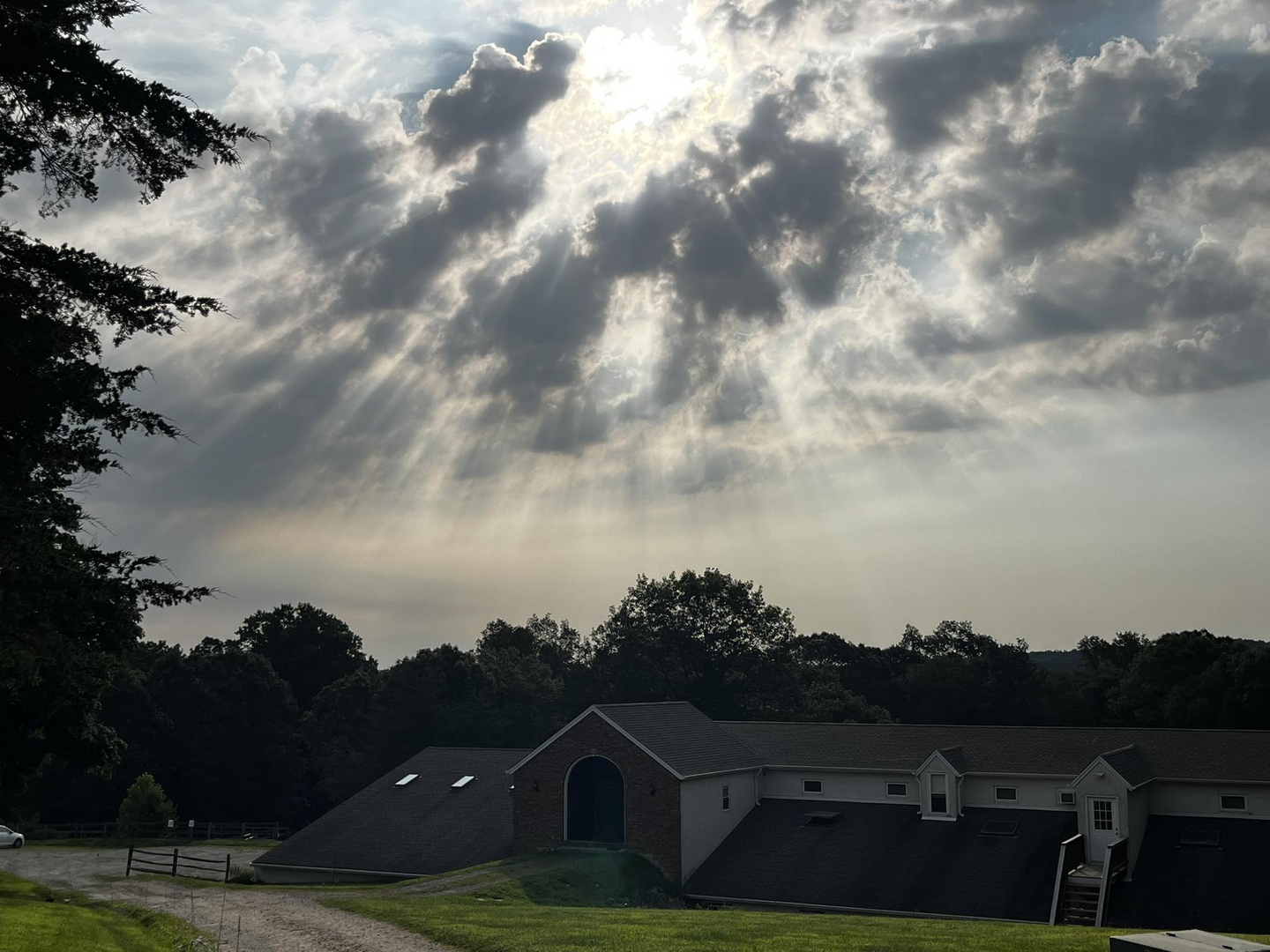 Sunny Brook Farm barn beneath dramatic skies
